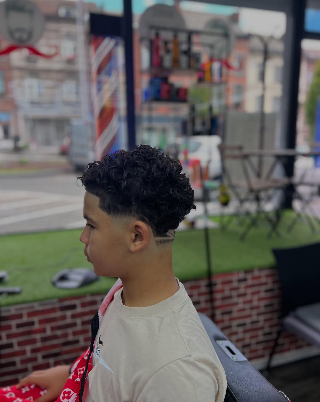 Après - curly fade avec design